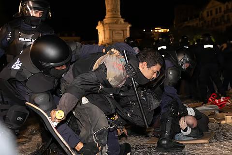 Police shoving a skater in Lisbon.